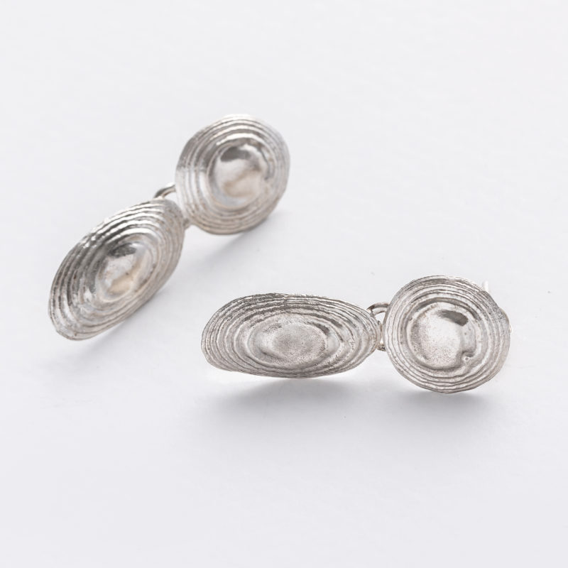 handmade stud earrings made of recycled silver with swirl design